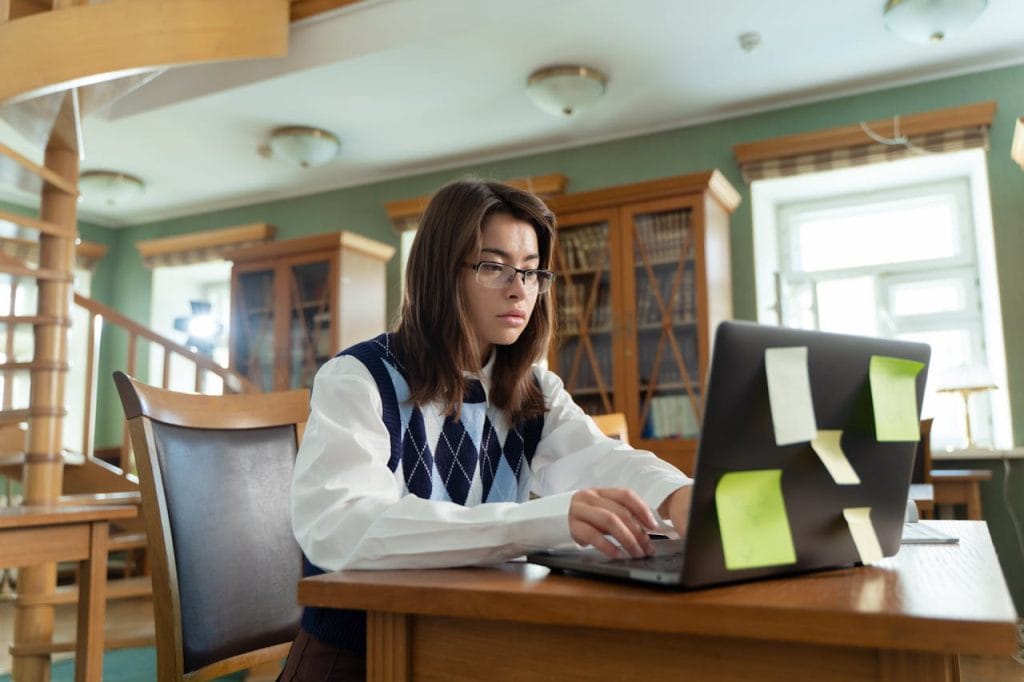 female student writing essay